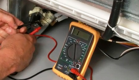 Checking the dishwasher's heating element with a multimeter