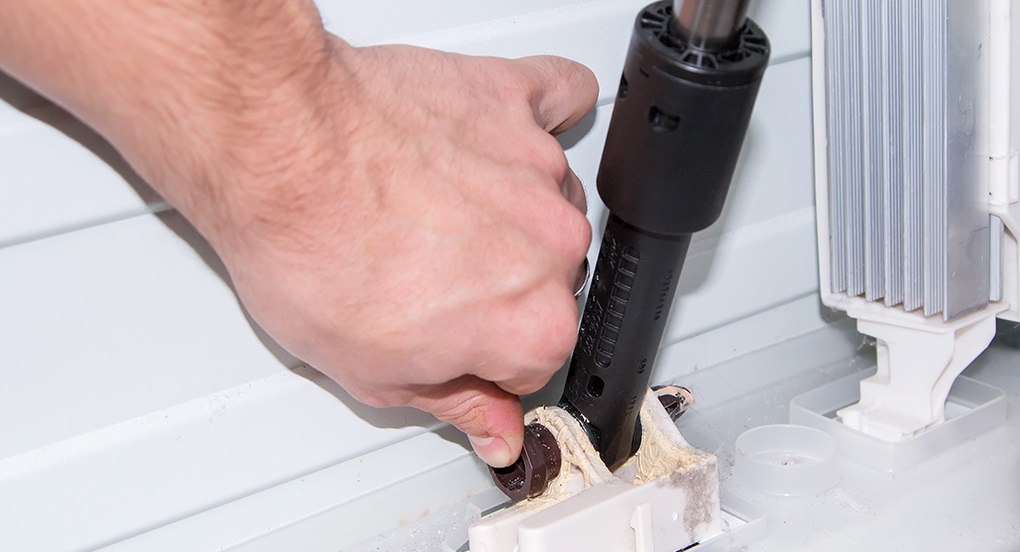 Installing a shock absorber on a top-loading washing machine