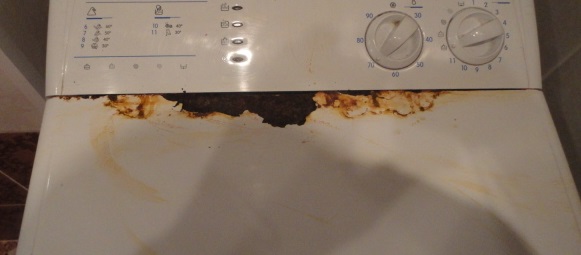 rusty top-loading washing machine