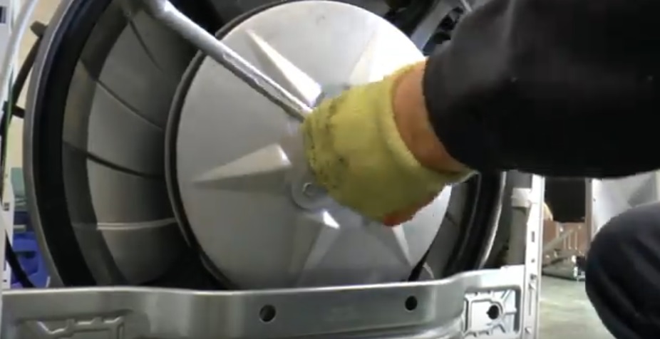 unscrew the bolt holding the pulley