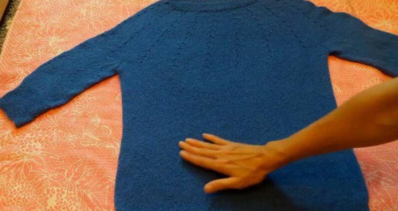 spread the sweater on a towel