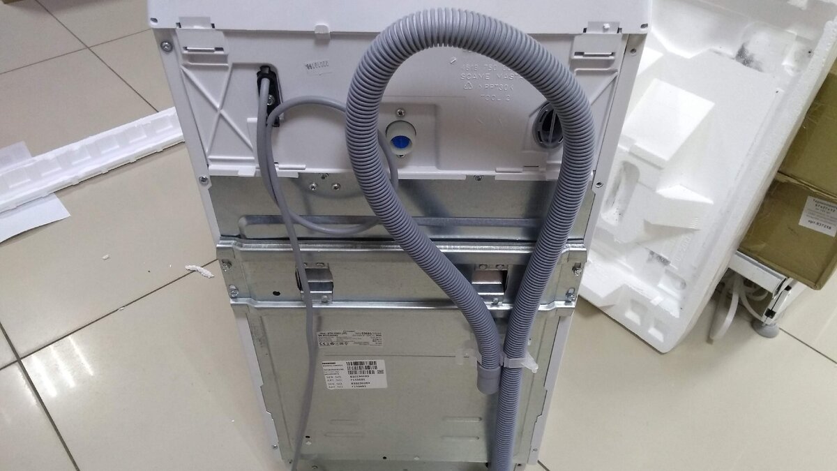 Where are the shipping bolts on a top-loading washing machine?