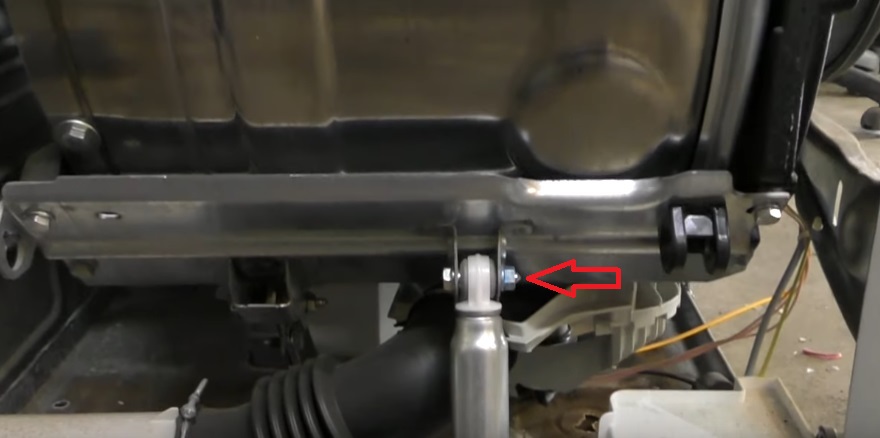 unscrew the shock absorbers