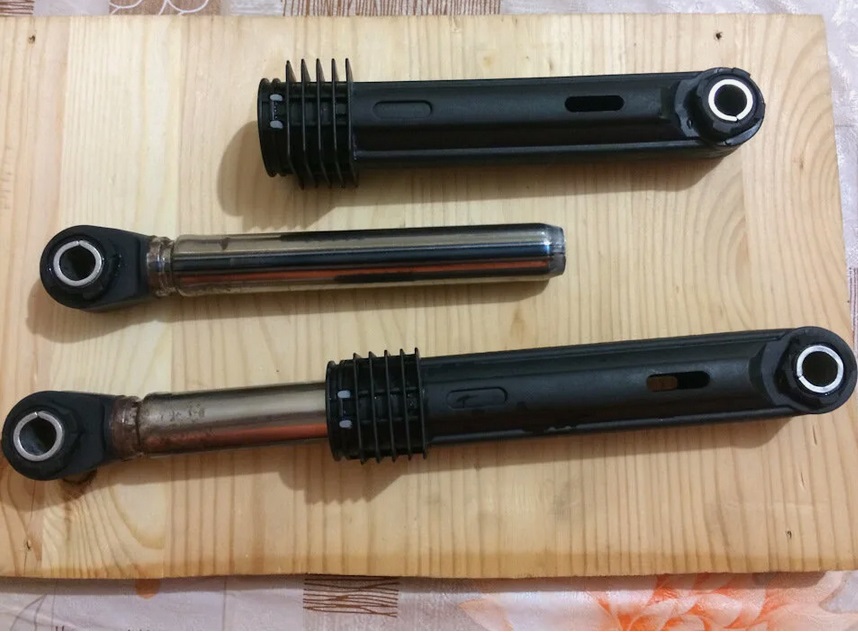 Signs of faulty washing machine shock absorbers