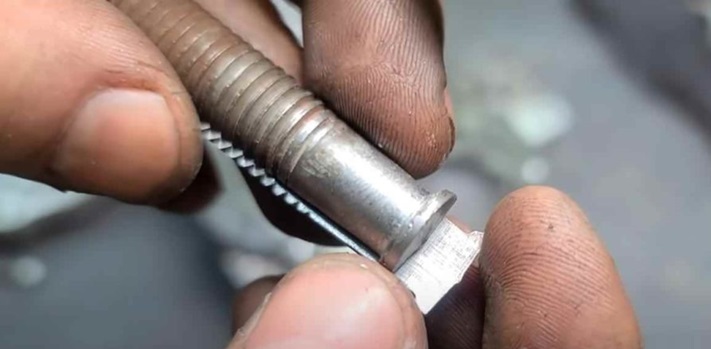 grind down the bolt head