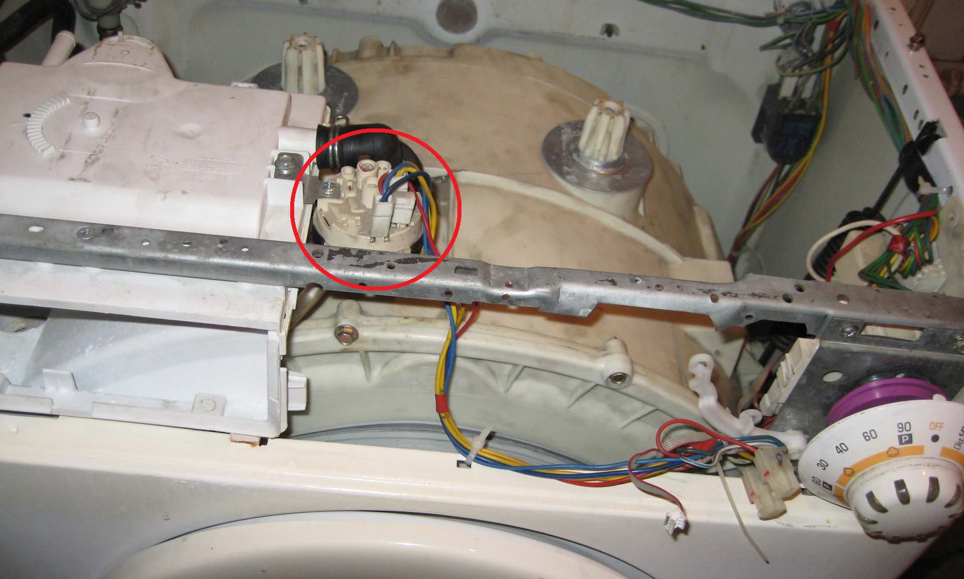 Where to find the pressure switch on a Candy washing machine