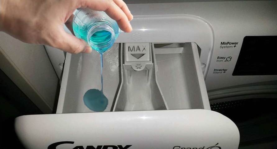 pour gel into the Candy washing machine