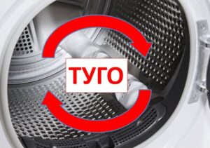 The drum in the dryer is spinning slowly. The drum in the dryer is spinning slowly.