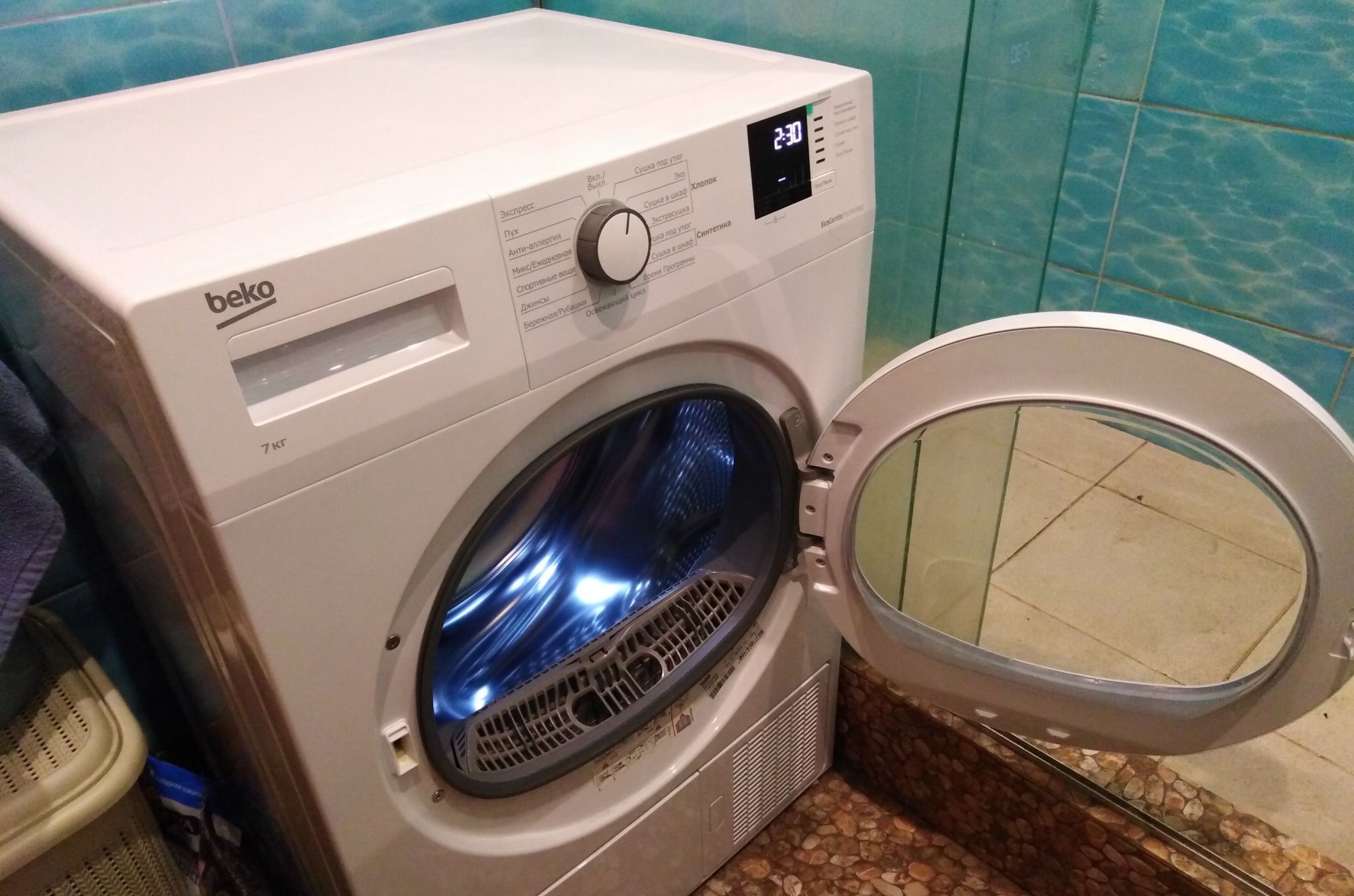 Beko DF7412GA tumble dryer in an interior